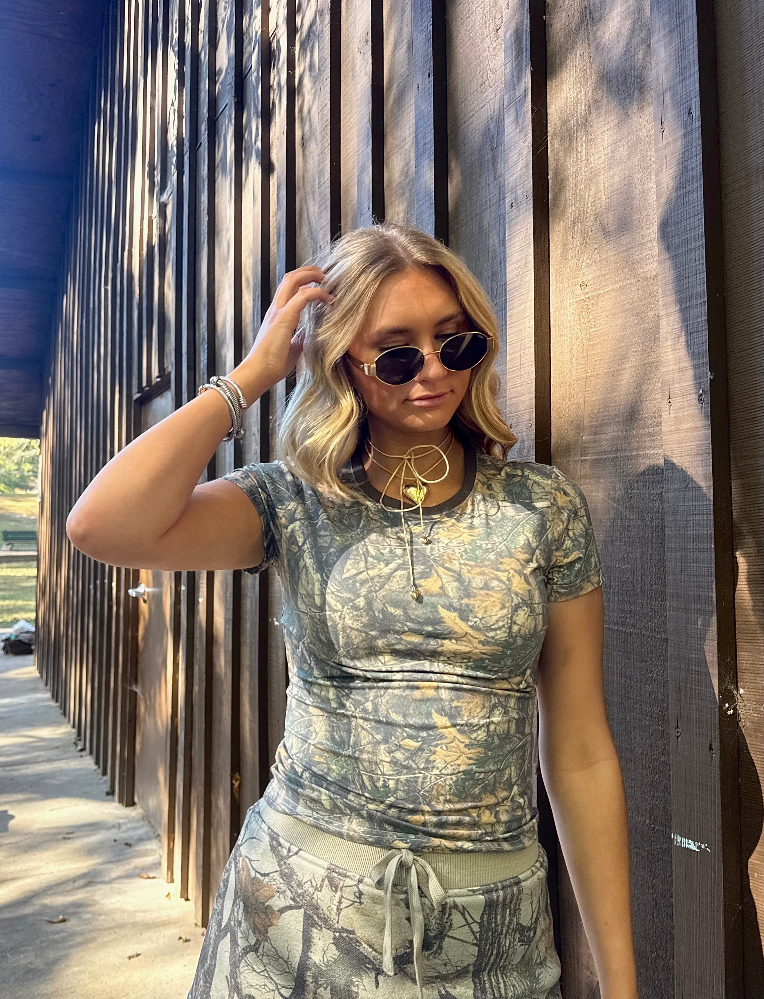 OUT OF THE WOODS BABY TEE